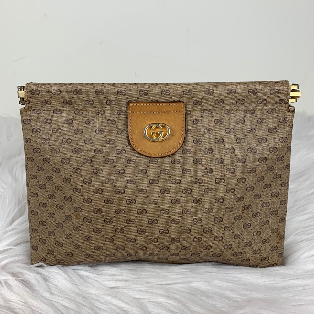 Gucci supreme GG metal top clutch